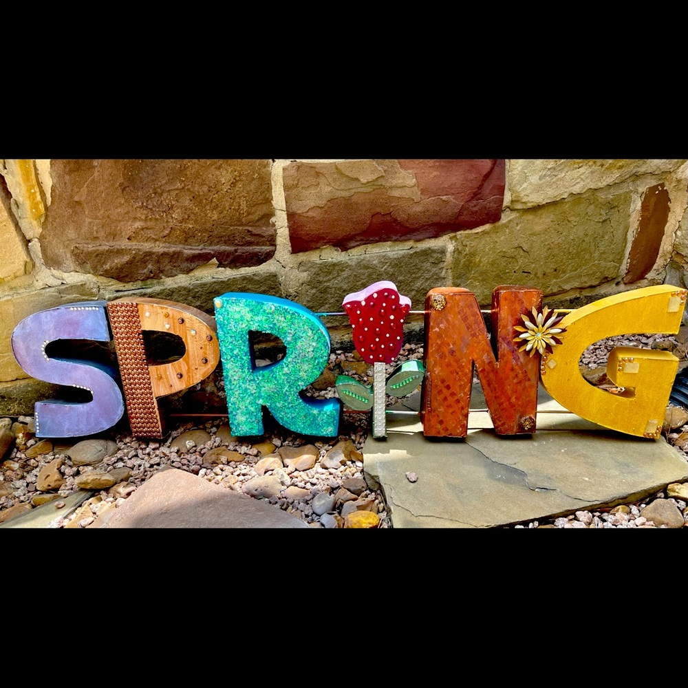 Hollow metal “SPRING” hang/sit in yard/porch/patio. Uniquely decorated by hand